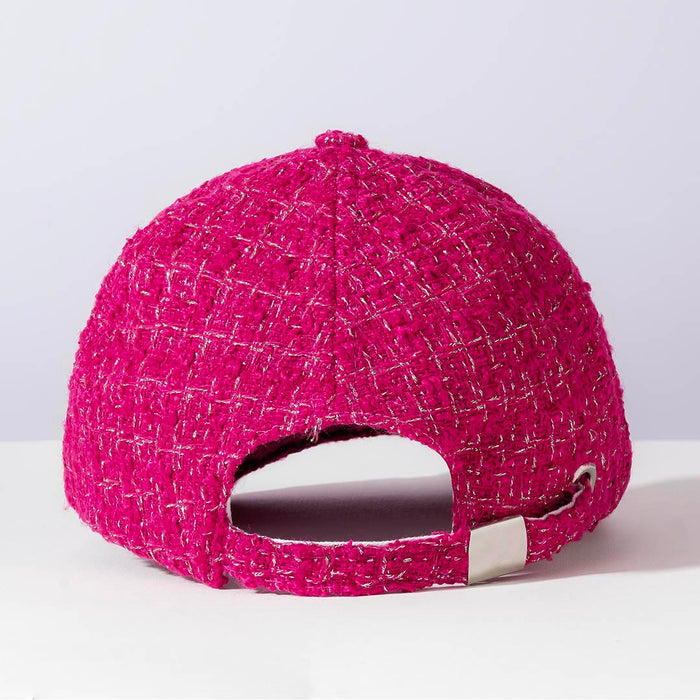 Pink textured baseball cap on a light gray background