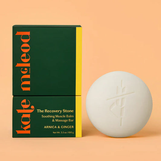 Kale Meleod lotion bar and packaging on a peach background