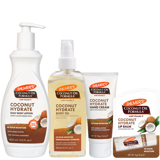 Four Palmer's Coconut Oil Formula body care products from the Coconut Hydrate line, including Daily Body Lotion, Body Oil, Hand Cream, and Lip Balm, arranged on a plain white background.