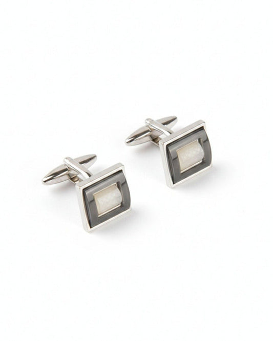 Men’s square cufflinks in silver-tone metal with gray inset stone, hinged backing.