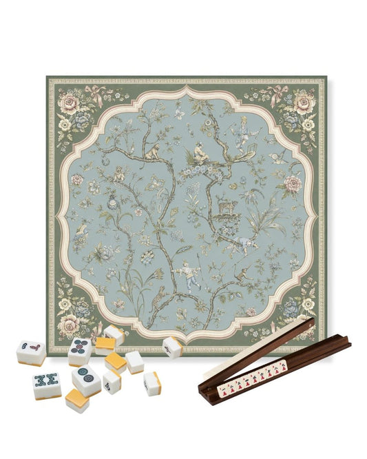 Decorative square table mat with blue floral center and ornate cream border
