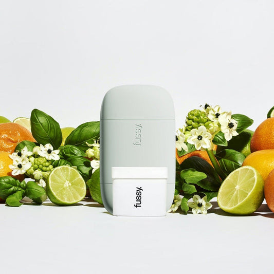Fussy's natural, refillable deodorant starter pack in Tropic Tonic scent (lime, marjoram, basic, mandarin) with deodorant case in Mint Green colour.