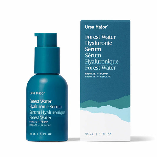 A blue bottle of Ursa Major Forest Water Hyaluronic Serum and its blue and white packaging against a white background.